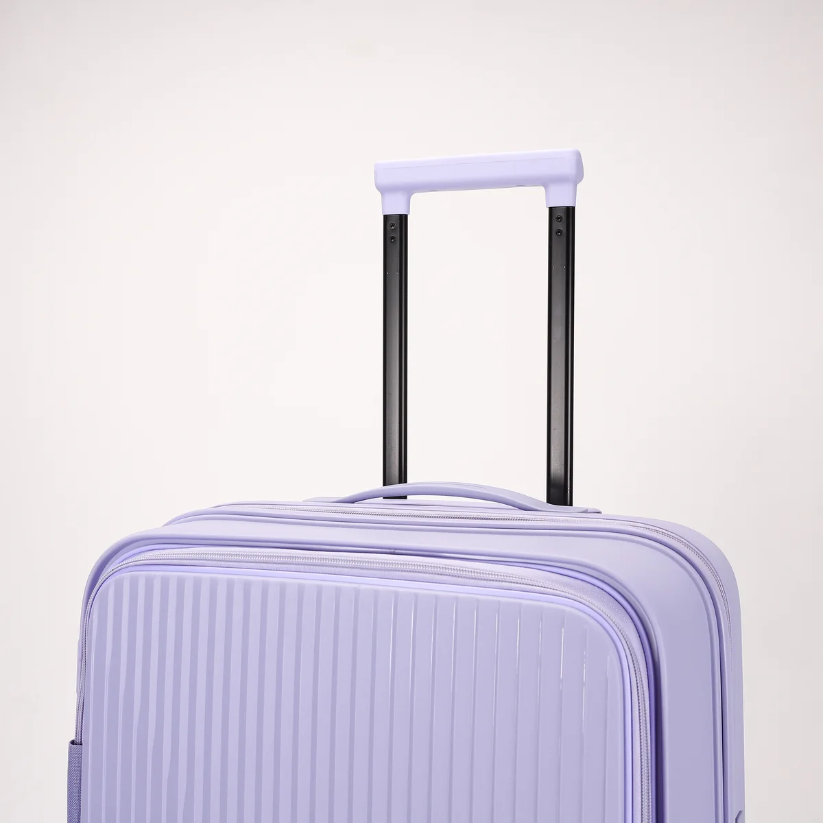 Close-up of trolley handle and shell on a PP case